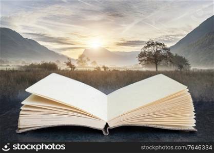 Beautiful foggy misty fall sunrise over countryside surrounding crummock water in lake district in england coming out of pages in a book