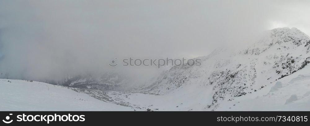 Beautiful foogy Winter morning in Mountains. Landscape with Todorka Peak panorama, Pirin mountain, Bansko, Bulgaria.