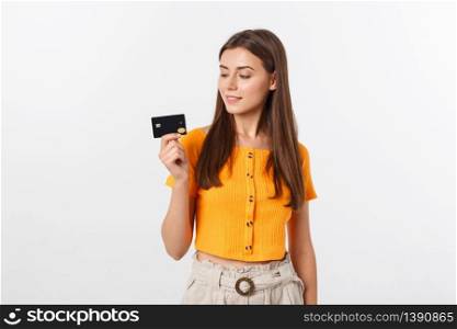 beautiful friendly smiling confident girl showing black card in hand, isolated over white background. beautiful friendly smiling confident girl showing black card in hand, isolated over white background.