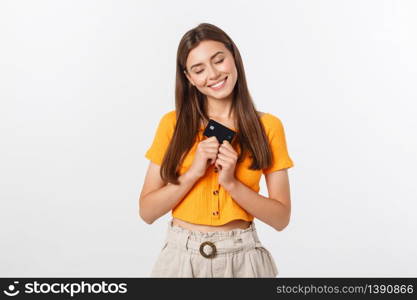 beautiful friendly smiling confident girl showing black card in hand, isolated over white background. beautiful friendly smiling confident girl showing black card in hand, isolated over white background.