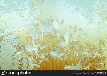 Beautiful frosty glass frostwork and ice flowers on window glass