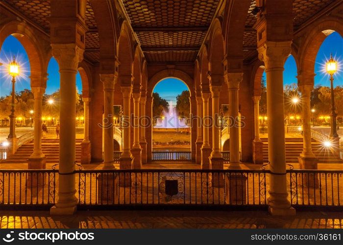 Beautiful Gallery with columns on Spain Square or Plaza de Espana in Seville at night, Andalusia, Spain