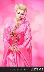 Beautiful geisha with a sacura isolated on abstract background