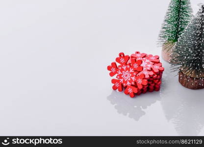 Beautiful gingerbread on a brown ceramic plate with Christmas tree decorations on a dark concrete background. Getting home ready for Christmas. Beautiful gingerbread on a brown ceramic plate with Christmas tree decorations