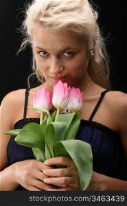 beautiful girl and lovely pink tulips