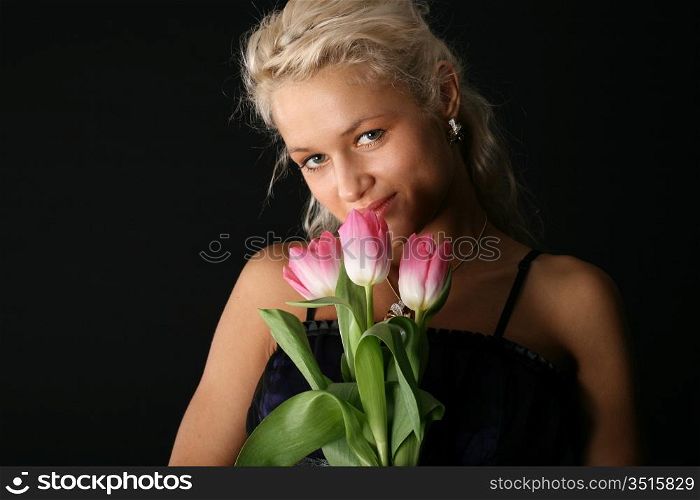 beautiful girl and lovely pink tulips