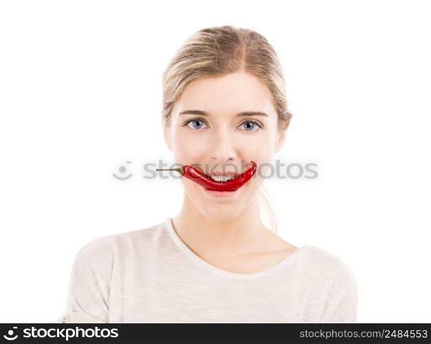 Beautiful girl biting a red chilli pepper, isolated over a white background