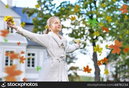 Beautiful girl enjoying an autumn