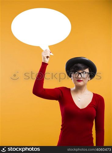 Beautiful girl holding a thought balloon over her head with copy space