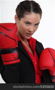beautiful girl holding boxing gloves