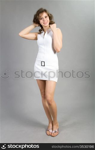 beautiful girl in a white short dress