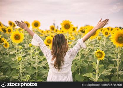 beautiful girl in field of sunflowers vintage