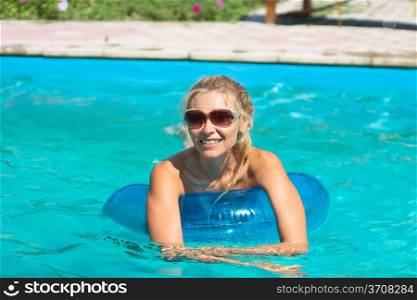 Beautiful girl in swimming pool at a spa