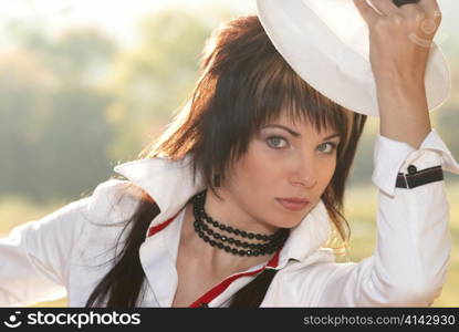 Beautiful girl in the white hat- soft background portrait