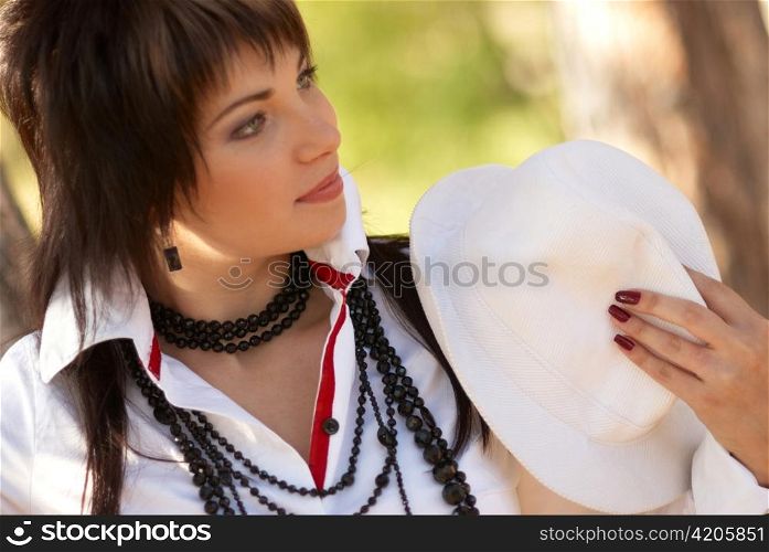 Beautiful girl in the white hat- soft background portrait