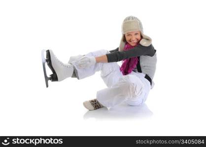 Beautiful girl in winter clothes puts on skates. Isolated on white background