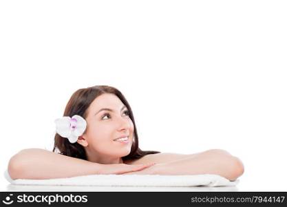 beautiful girl on a spa procedure looking at the empty space