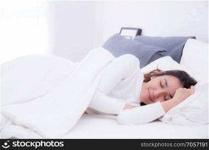 Beautiful girl on bed sleeping at home in the bedroom