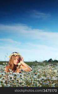 beautiful girl on the daisy flowers field