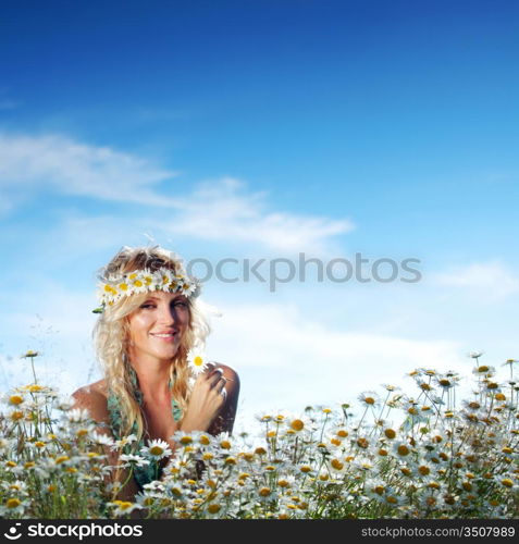 beautiful girl on the daisy flowers field