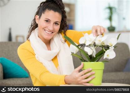 beautiful girl posing for photo with flowers