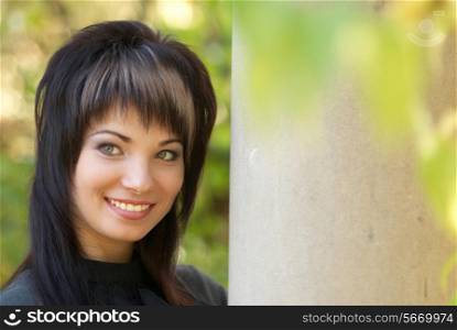 Beautiful girl&rsquo;s portrait near the column with soft background