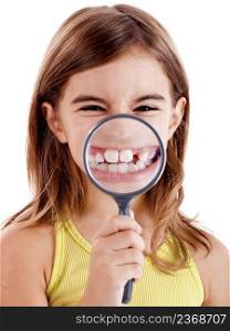 Beautiful girl showing teethes through a magnifying glass