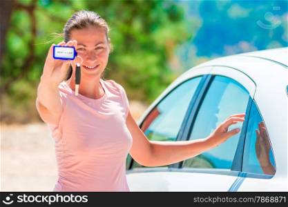 beautiful girl shows rental car Keychain