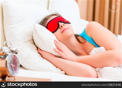 beautiful girl sleeping with a mask on the eyes