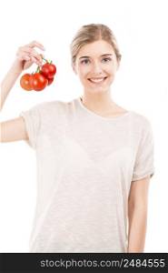 Beautiful girl smiling and holding red tomatoes in the hands, isolated over a white background
