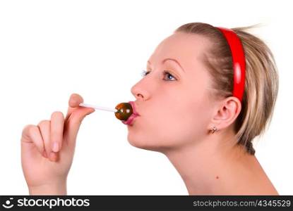 Beautiful girl sucking lollipop on white