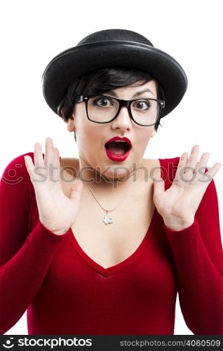 Beautiful girl wearing a hat and nerd glasses asn astonished with something
