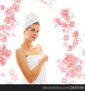 Beautiful girl wearing bath towels and flowers around her