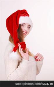 Beautiful girl wearing christmas cap. Young woman cheering in santa hat. Celebration fashion costume relax concept. . Beautiful girl wearing christmas cap.