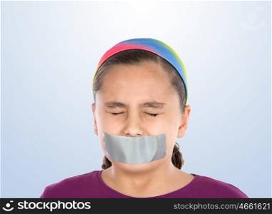 Beautiful girl with adhesive on her mouth and closed eyes isolated over blue