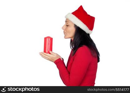 Beautiful girl with Christmas blowing a candle on a over white background
