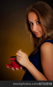 beautiful girl with cup of coffee, yellow background