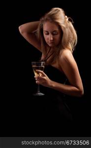 beautiful girl with glass of wine, black background