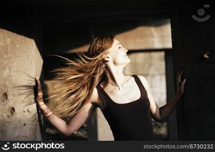 beautiful girl with hair fluttering in the wind