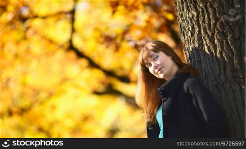 beautiful girl with long hair in autumn park