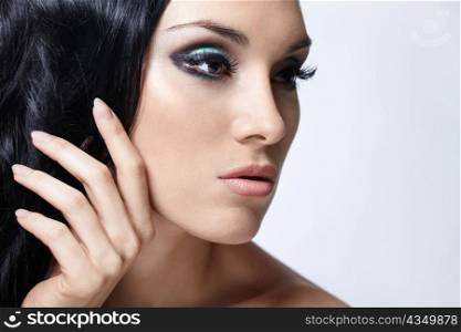 Beautiful girl with makeup and styling on the white background