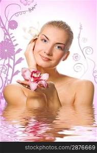 Beautiful girl with orhid flowers in rendered water