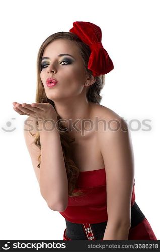 beautiful girl with red and elegant dress and one bow in the hair, she is turned of three quarters at right and sends one kis with one hand