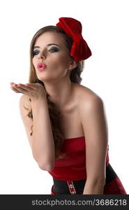 beautiful girl with red and elegant dress and one bow in the hair, she is turned of three quarters at right and sends one kis with one hand