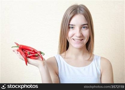 beautiful girl with red pepper