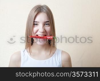 beautiful girl with red pepper
