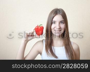 beautiful girl with red sweet pepper