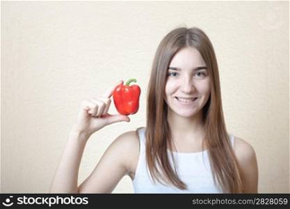 beautiful girl with red sweet pepper