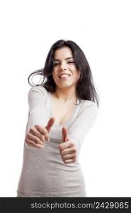 Beautiful girl with thumbs up, isolated against a white background