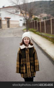 Beautiful girl with wool hat at winter in the street